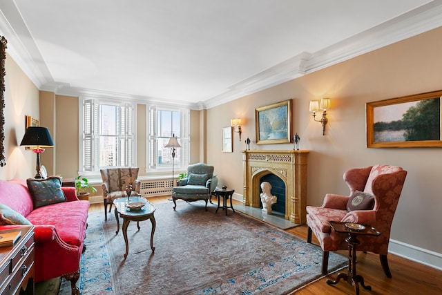 living room featuring hardwood / wood-style floors and ornamental molding