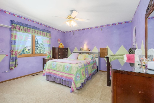 bedroom featuring light carpet and ceiling fan