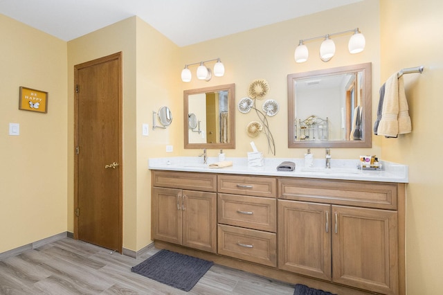 bathroom featuring vanity and wood-type flooring