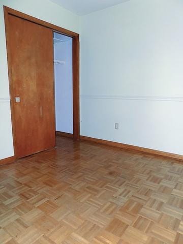 spare room with light parquet floors