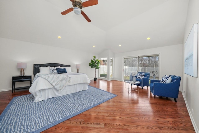 bedroom featuring ceiling fan, dark wood-type flooring, and lofted ceiling