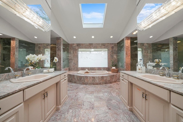 bathroom with vanity, lofted ceiling with skylight, tile walls, and independent shower and bath