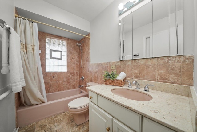 full bathroom featuring shower / bath combination with curtain, vanity, toilet, and tile walls