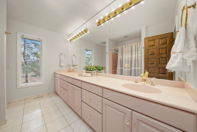 bathroom with tile patterned flooring, vanity, and a shower with shower curtain