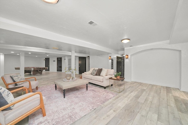 living room with light hardwood / wood-style floors and pool table