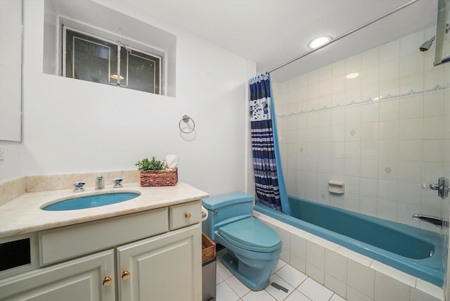 full bathroom featuring tile patterned flooring, vanity, toilet, and shower / tub combo with curtain