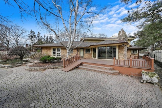 view of front of property featuring a wooden deck