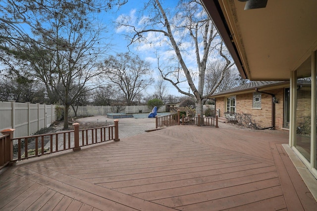 wooden terrace with a swimming pool