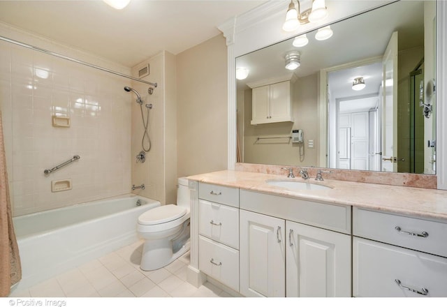 full bathroom with tiled shower / bath combo, tile patterned floors, vanity, and toilet