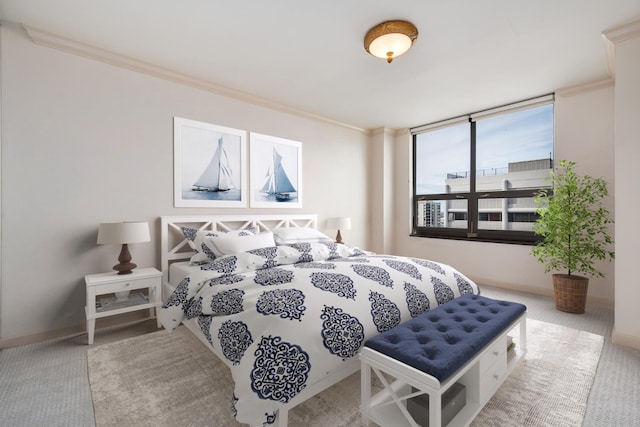 carpeted bedroom with ornamental molding