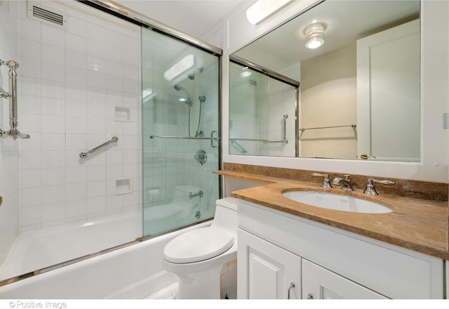 full bathroom with shower / bath combination with glass door, toilet, and vanity