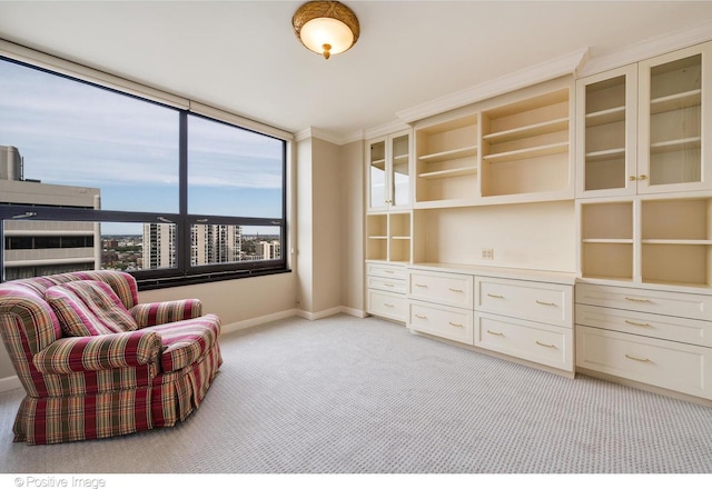 unfurnished room featuring light carpet and crown molding