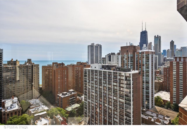 property's view of city featuring a water view