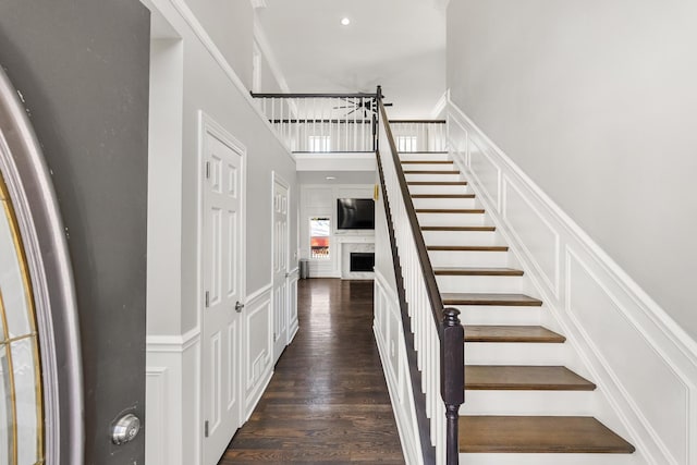 stairway featuring wood-type flooring