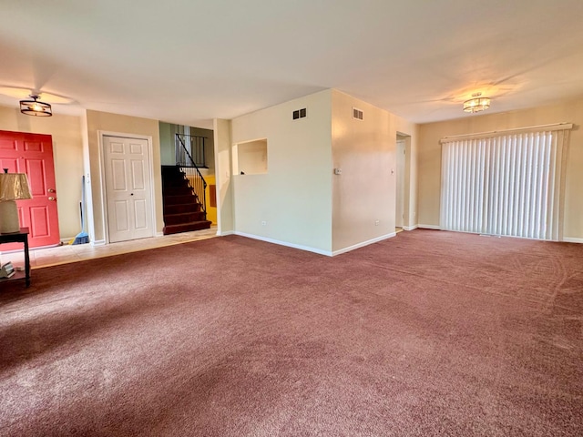 unfurnished living room featuring carpet