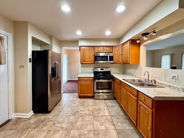 kitchen with sink and appliances with stainless steel finishes