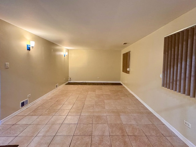 empty room with light tile patterned floors