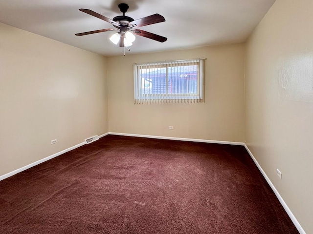 empty room featuring carpet and ceiling fan