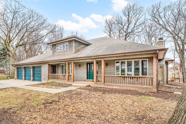 bungalow-style house featuring a porch and a garage