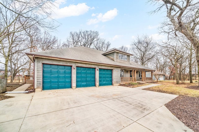 view of front of home with a porch and a garage