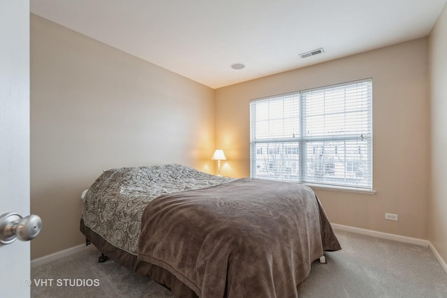 bedroom featuring light colored carpet