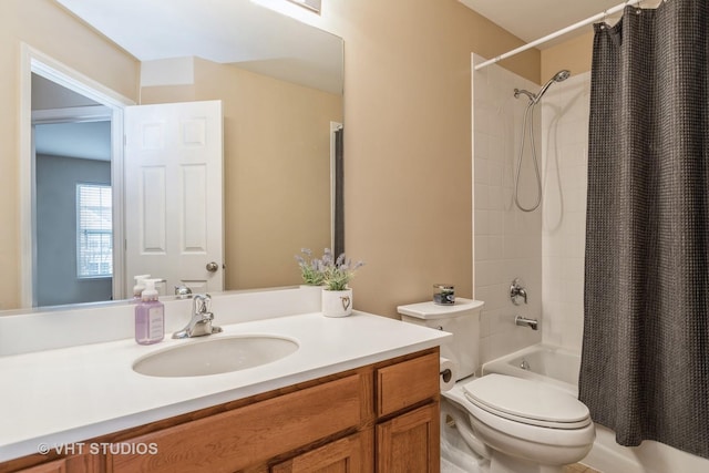 full bathroom featuring vanity, shower / bath combination with curtain, and toilet