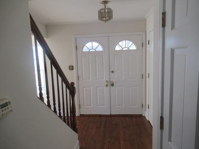 entryway with dark hardwood / wood-style floors