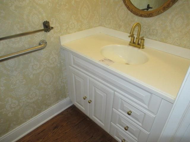 bathroom with vanity and hardwood / wood-style flooring