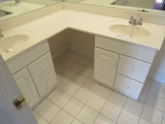 bathroom with tile patterned floors and vanity