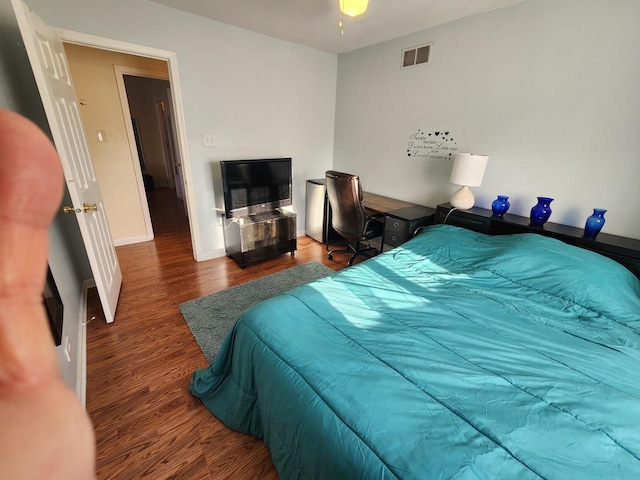 bedroom featuring dark hardwood / wood-style flooring