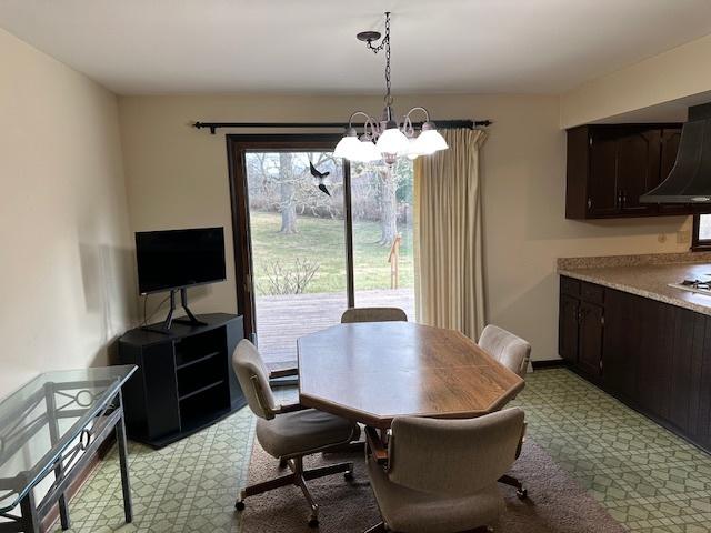 dining space with a chandelier