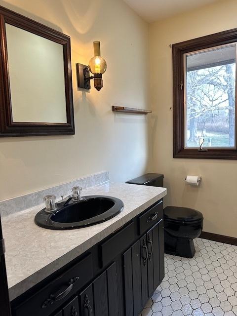 bathroom featuring vanity and toilet