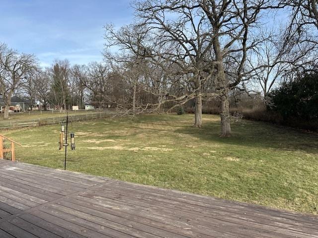 wooden terrace with a yard