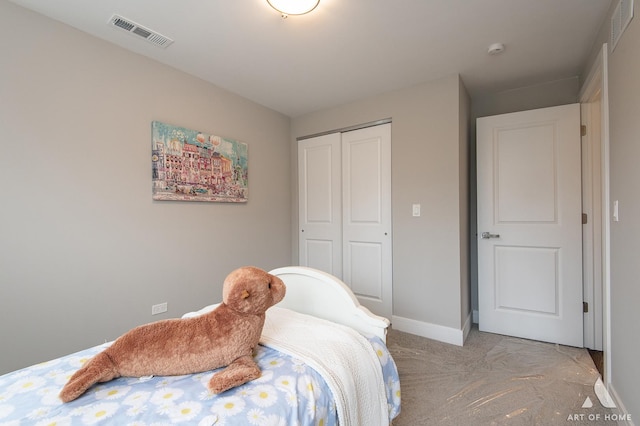 carpeted bedroom with a closet