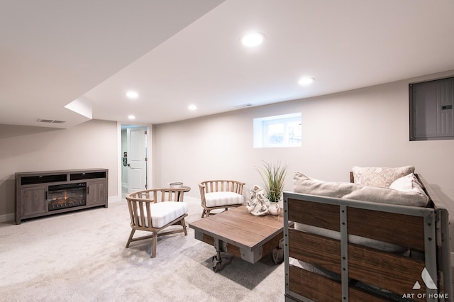 living area featuring light colored carpet