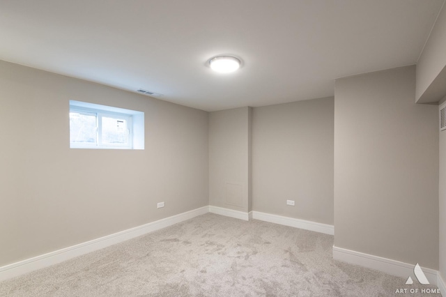 empty room featuring light colored carpet