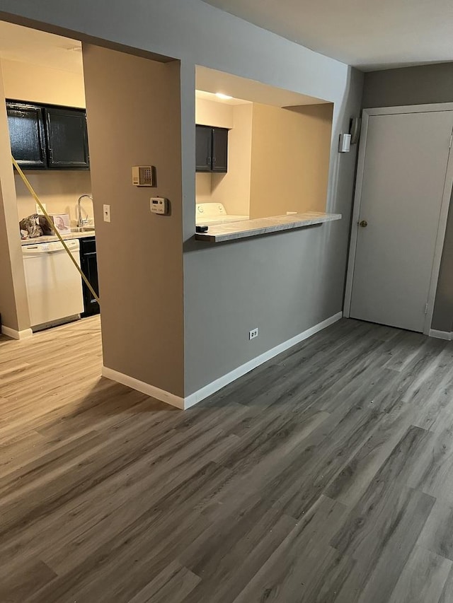 interior space with dark hardwood / wood-style flooring and sink