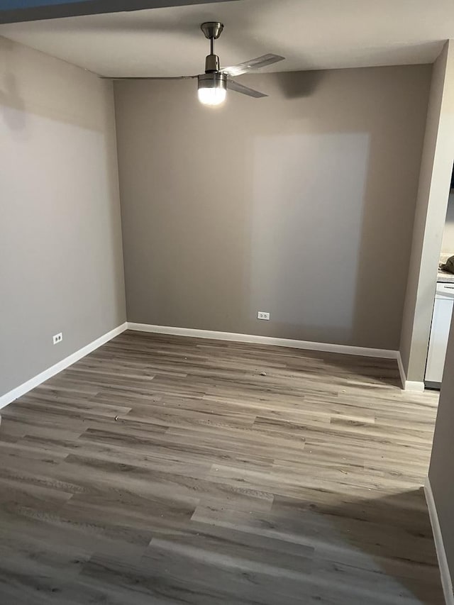 spare room featuring ceiling fan and hardwood / wood-style floors