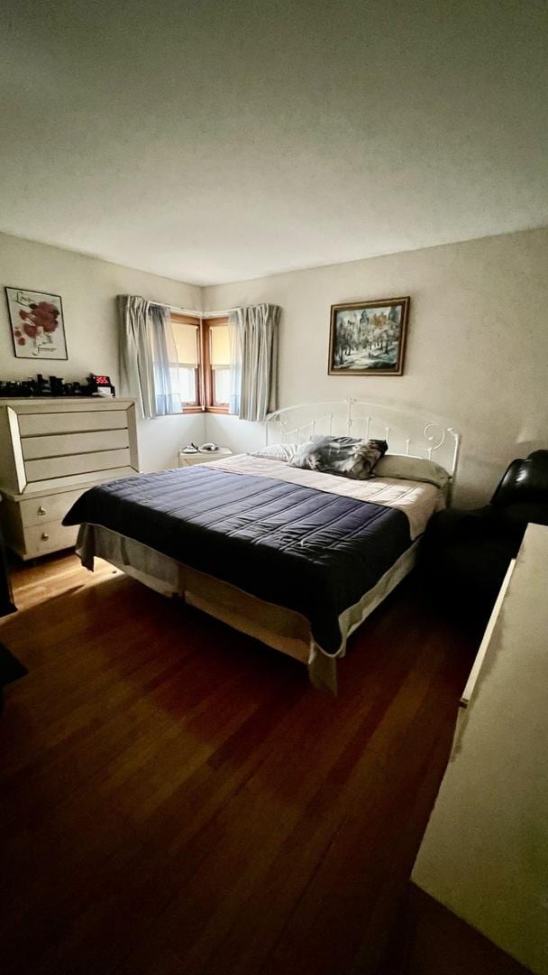 bedroom featuring dark hardwood / wood-style flooring