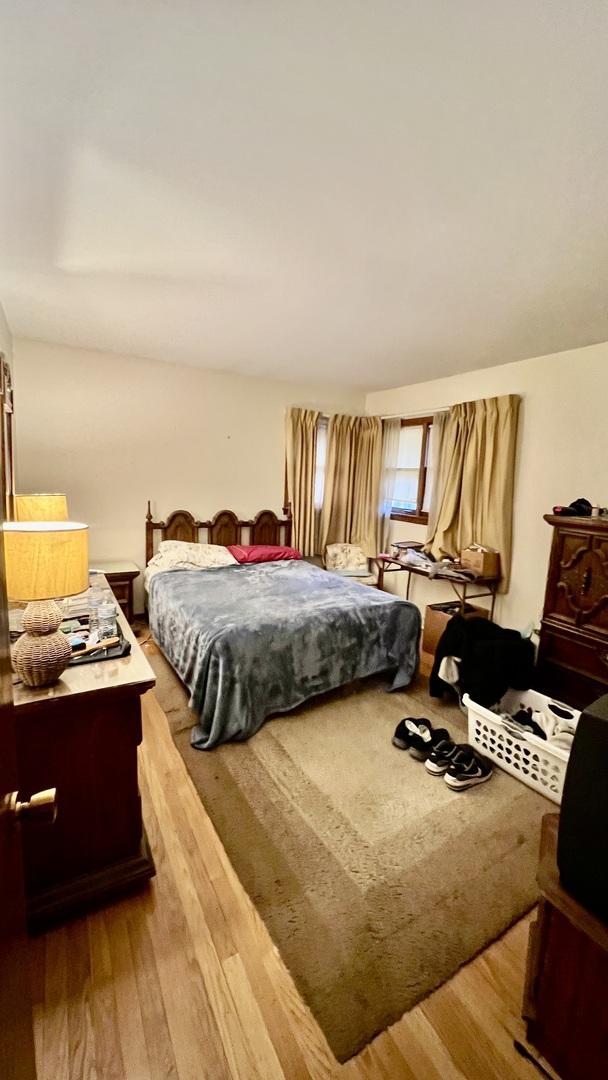 bedroom with light hardwood / wood-style floors