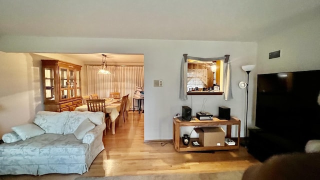 living room with light hardwood / wood-style flooring