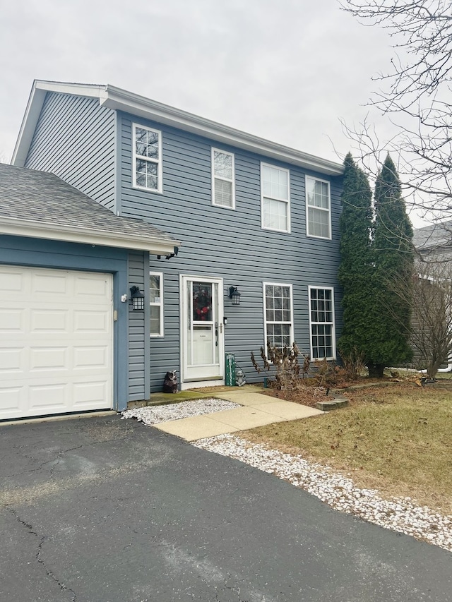 colonial home featuring a garage