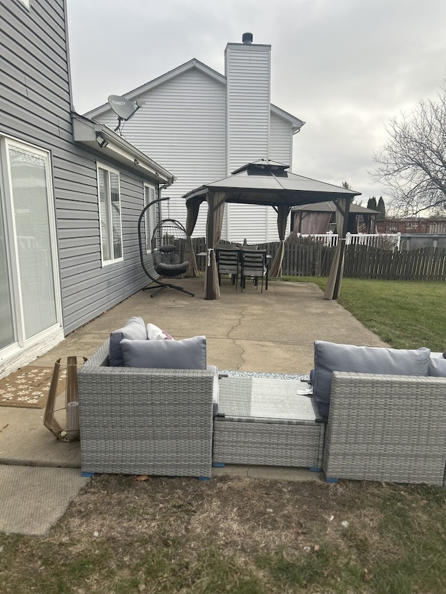 view of patio with a gazebo and an outdoor hangout area