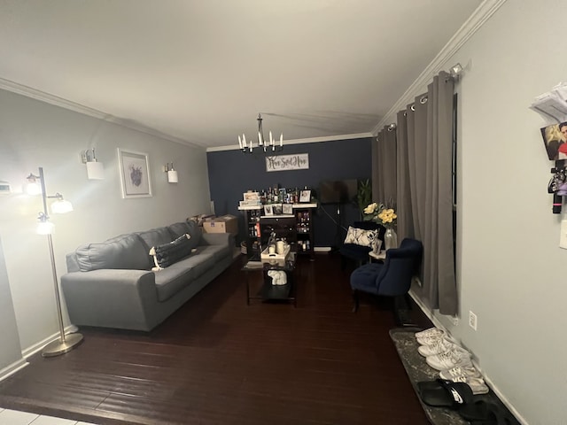 living room with ornamental molding, hardwood / wood-style floors, and an inviting chandelier