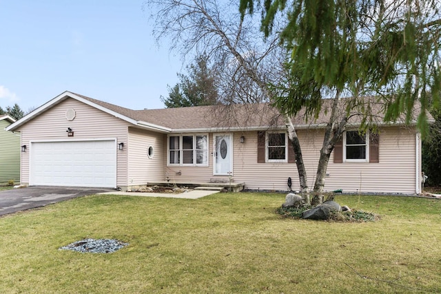 single story home with a front yard and a garage