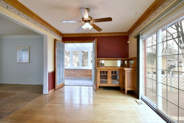 interior space with ceiling fan