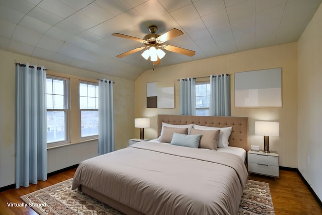 bedroom with dark wood-type flooring and ceiling fan