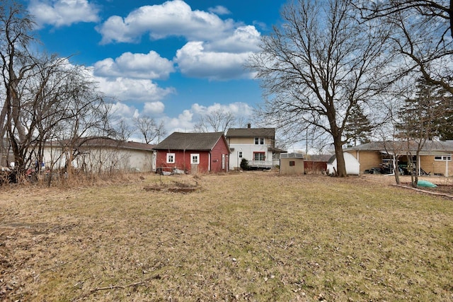 back of house with a yard