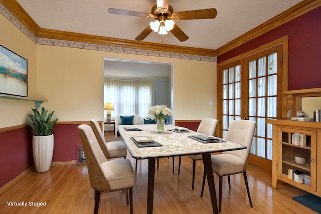 dining room featuring light hardwood / wood-style flooring, ornamental molding, french doors, and ceiling fan