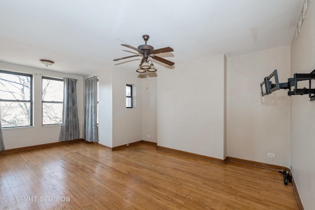 unfurnished room featuring light hardwood / wood-style flooring and ceiling fan